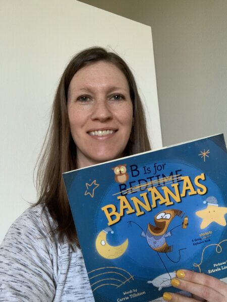 Author Carrie Tillotson holding her book B IS FOR BANANAS.